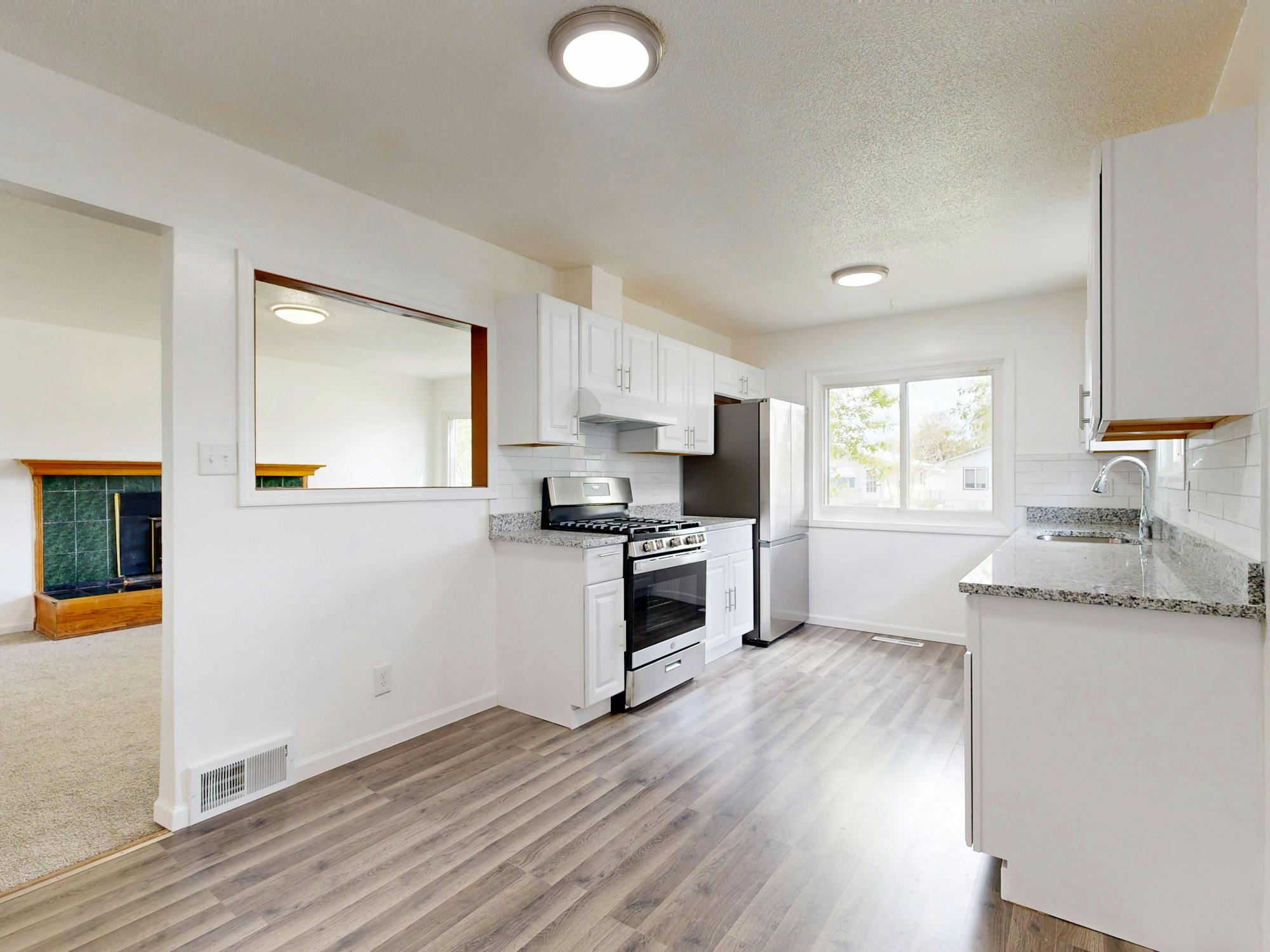 Newly renovated white kitchen with custom cabinets