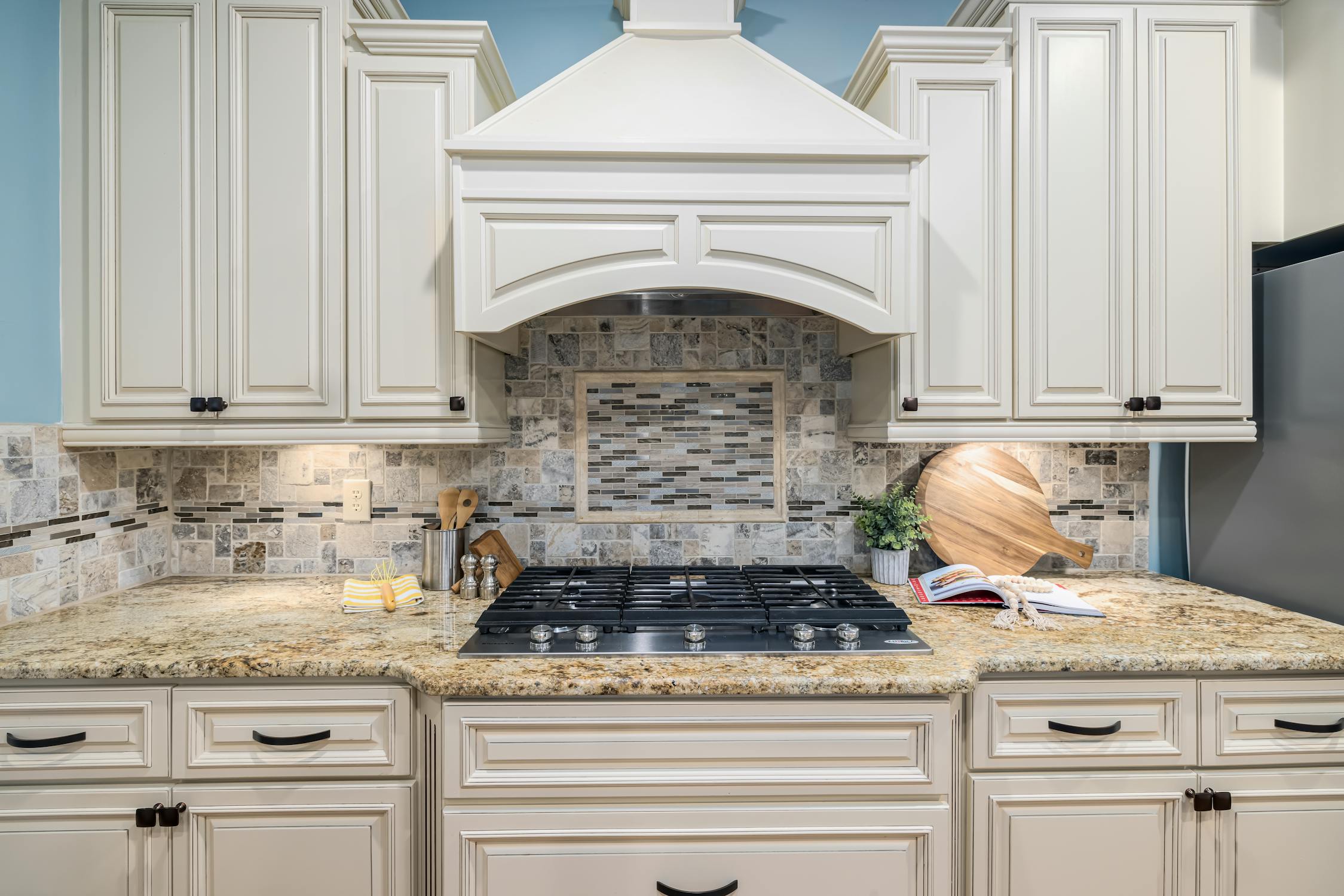 White shaker kitchen cabinets with marble countertops installed in Idaho Falls, Idaho
